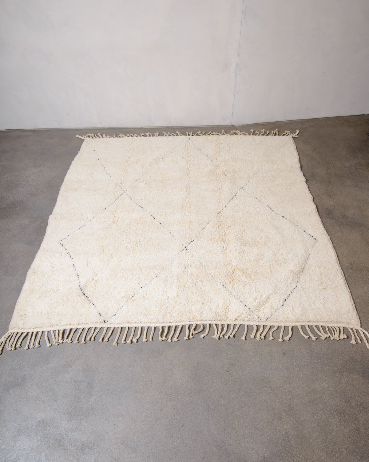 Modern, designer, handcrafted Berber rug from Morocco. Beniourain carpet with minimalist design, natural wool pile and a fluffy texture.
